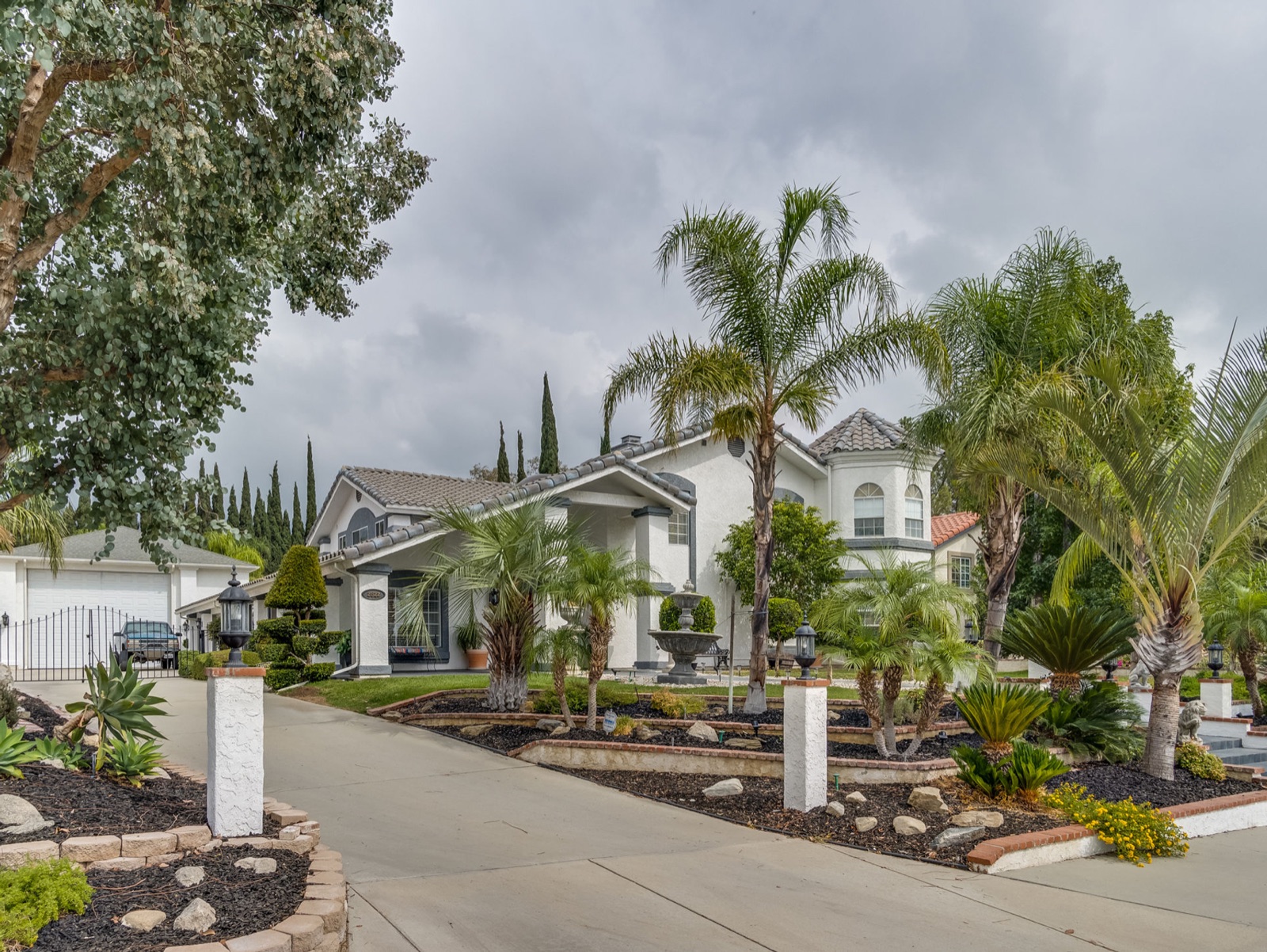The residence photographed under a flat overcast sky